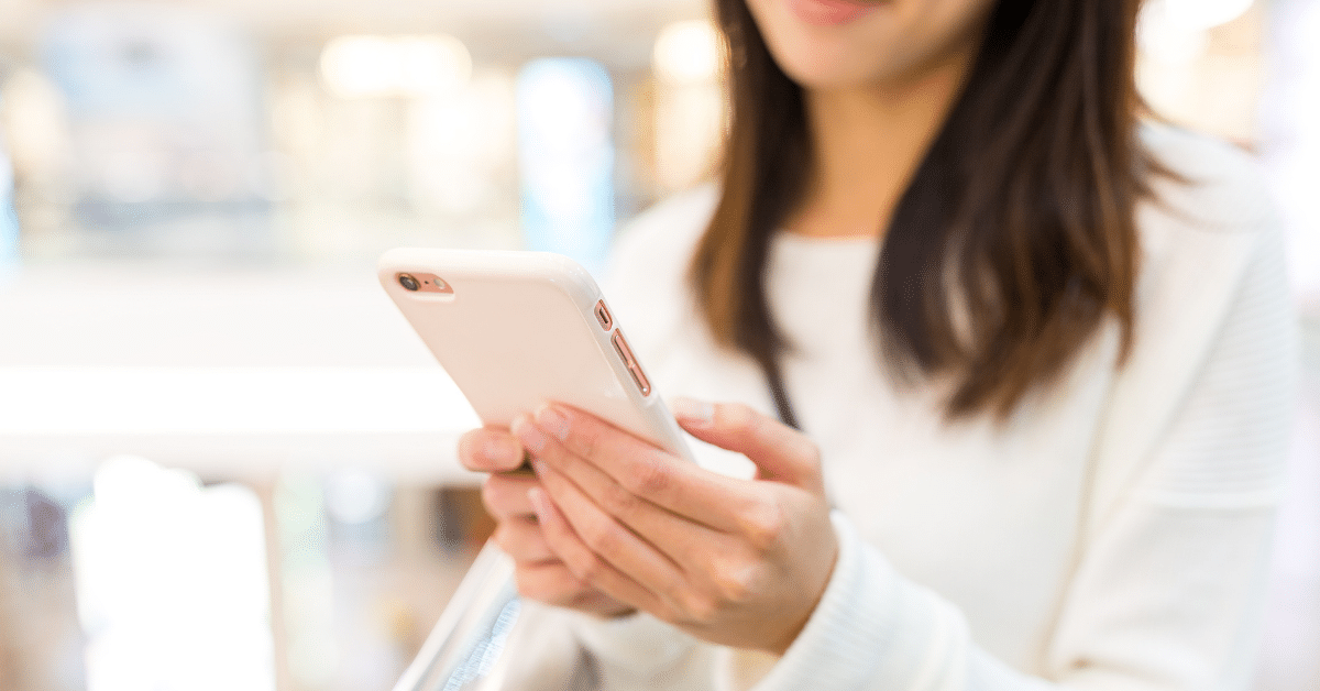 Woman holding an iphone