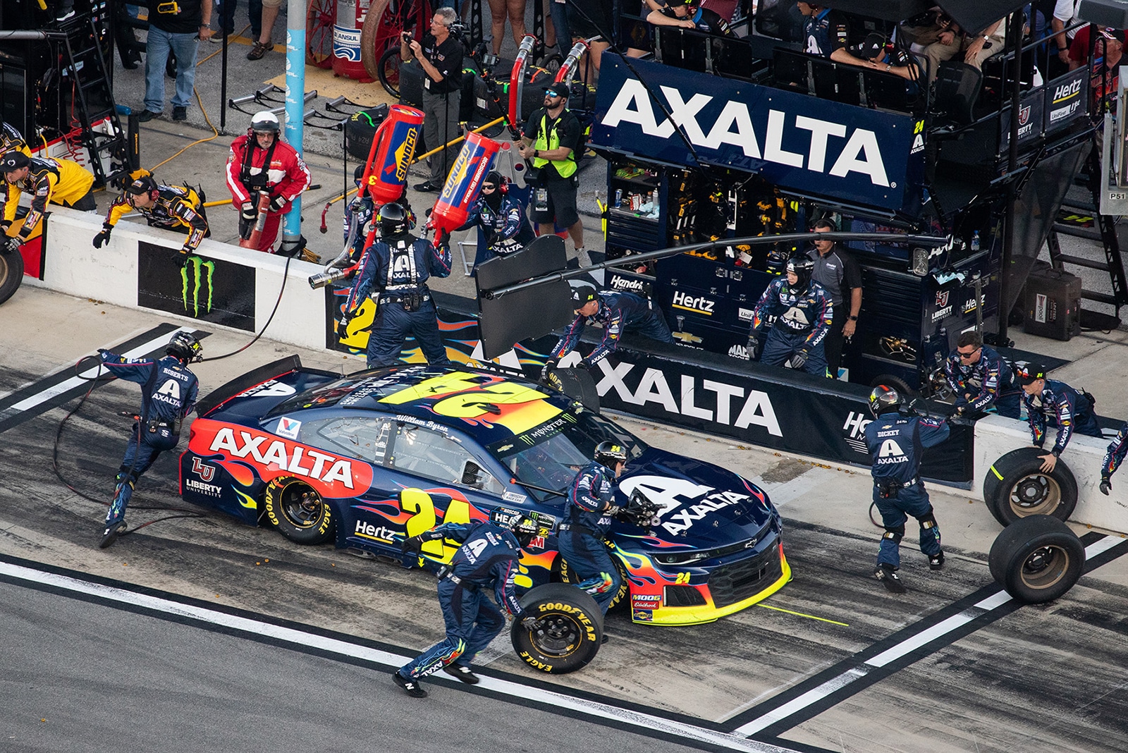 Image showing race car being fixed by a team