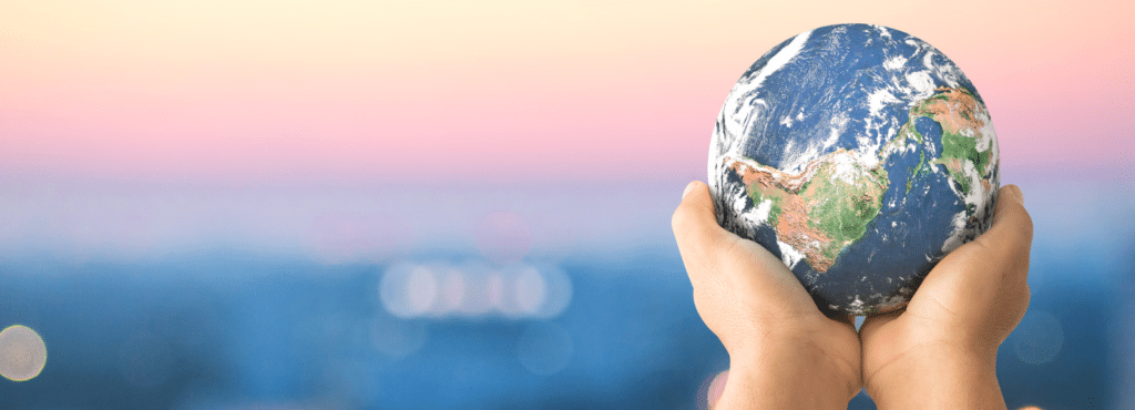a hand holding the globe